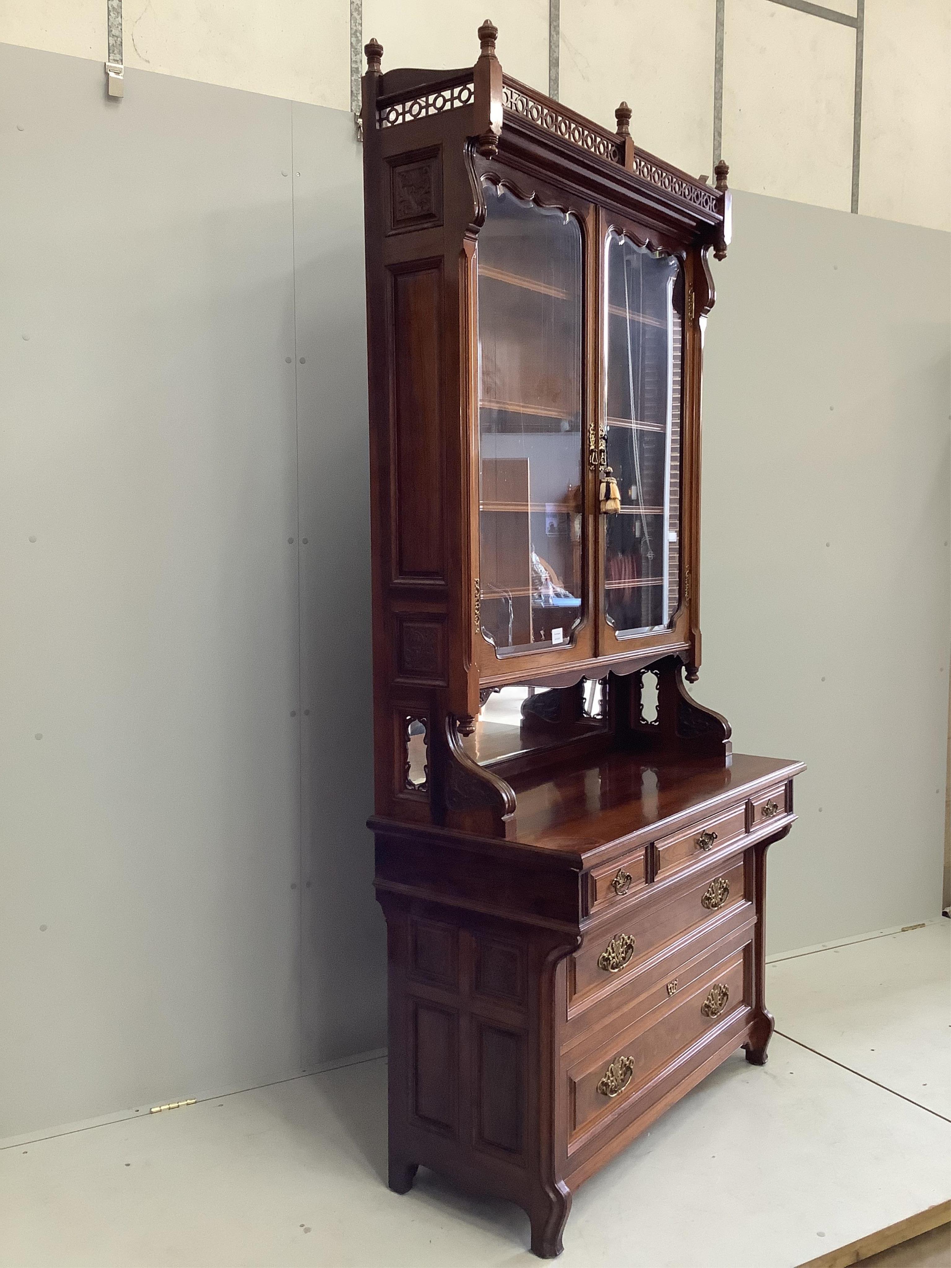 A Victorian rosewood bookcase, width 108cm, depth 52cm, height 232cm